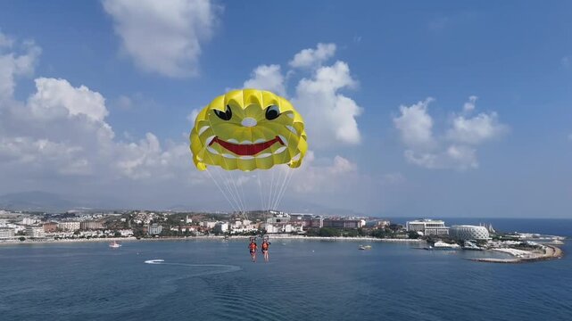Men and woman parasailing . High quality FullHD footage