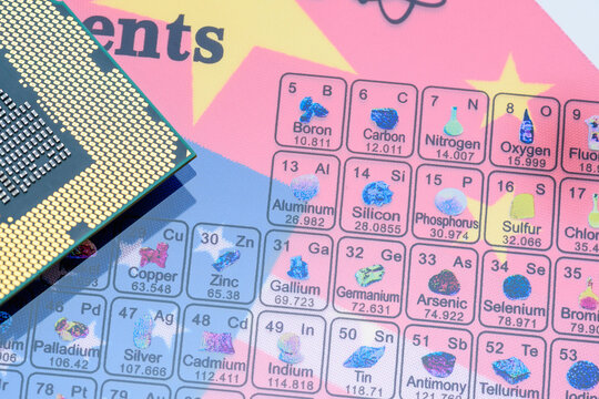 Geopolitical technology conflict, strategic tension over semiconductor supply chains, rare earth, minerals and raw material control : A CPU chip, a periodic table placed over the Chinese and US flags.