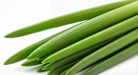 Obraz premium Fresh green chives arranged on a white background 
