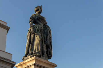 Madrid, Spain. Monument to Queen Isabel II in Plaza de Isabel II, in front of the Royal Theatre. Sculpted by Jose Piquer Duart in 1850, it honors the monarch who inaugurated the opera house