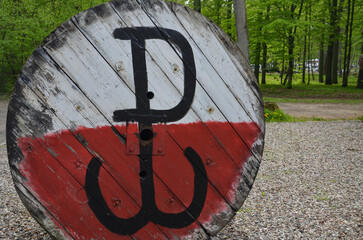Gierłoż  may 2,2025  the Polish fighting sign on a white and red background in the Wolf's Lair museum in Masuria