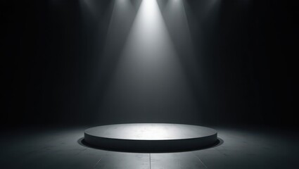 An empty circular stage illuminated by dramatic spotlights in a dark theatrical setting creating an atmosphere of anticipation for a performance
