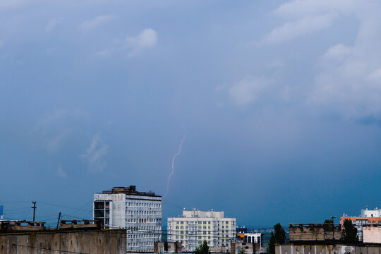 Storm clouds over the city ligthning during  rain