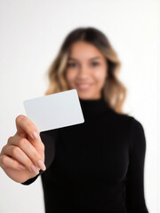 white card in the hand of a beautiful blonde woman