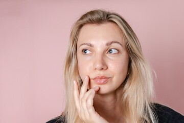 Attractive sensual young blond woman. Beauty woman portrait. Pink background. Nude or no makeup