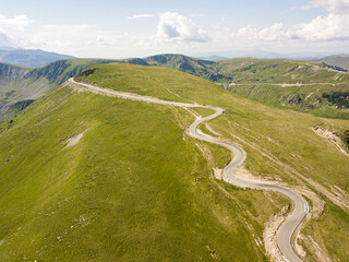 Aerial view of the spectacular Transalpina road with many serpentines crossing the Carpathian mountains at high altitude