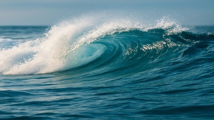Fototapeta premium Ocean Wave Curling in Blue Sea Under Clear Sky