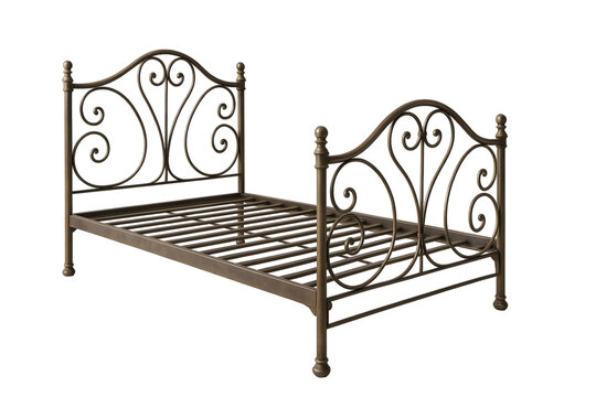 Elegant vintage metal bed frame with ornate scrolling design, perfect for a cozy bedroom setting.
