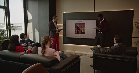 A diverse team of business professionals collaborates on a project, analyzing data and discussing footprint in a modern office. Teamwork, strategy, and innovation drive their success. - Powered by Adobe