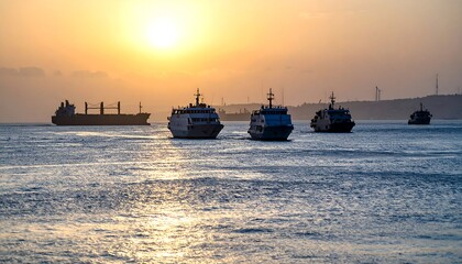 Ships at sunset over water