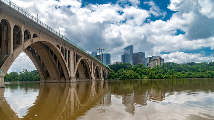 Glass Towers and Key Bridge from Georgetown Waterfront
Contemporary skyline with engineering structure spanning the Potomac River.