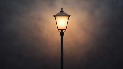 A glowing street lamp illuminates against a dark, cloudy sky, creating a warm and moody atmosphere.