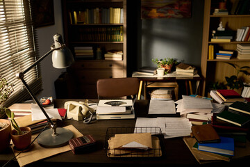 Vintage office desk featuring typewriter, rotary phone, scattered papers, books, folders, lamp,...