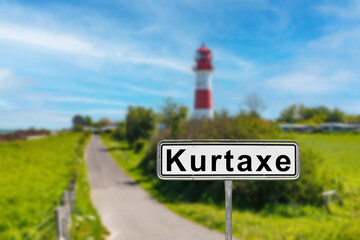 Kurtaxe sign with lighthouse and entering road in germany