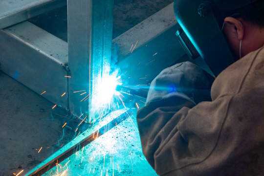 worker welding in a factory at horizonal composition
