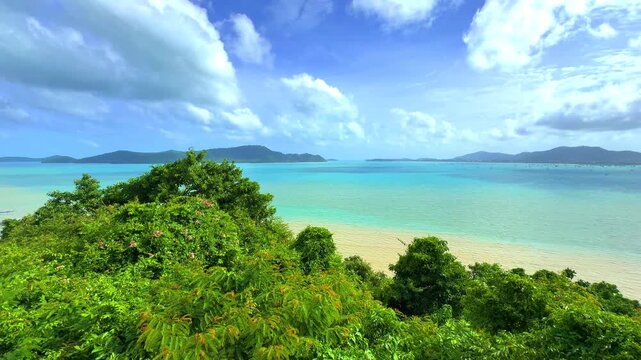 Beautiful view from Kao Khad next to Cape Panwa on the island of Phuket Thailand. Views of the turquoise Blue waters of the Andaman Sea and small islands off the coat of Phuket
