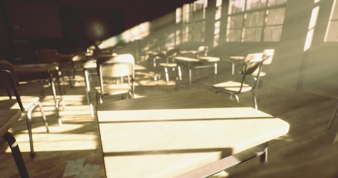 Warm rays of sunlight filter into an empty classroom filled with wooden desks and chairs. The soft light casts intriguing shadows on the floor, evoking a peaceful mood.