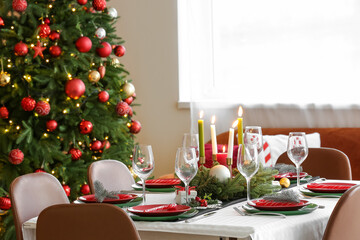 Festive table serving for Christmas celebration in dining room