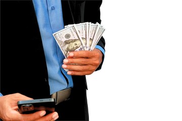 close up photo of businessman's hand holding dollar bill and mobile phone