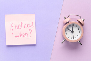 Sticky note with text IF NOT NOW, WHEN? and alarm clock on colorful background. Time management...