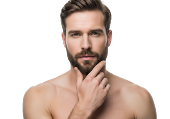 Close-up studio portrait of a handsome bearded man thoughtfully touching his chin