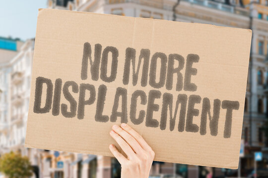 "No More Displacement" A protest against gentrification and forced relocation, demanding housing rights and community protection. HOUSING. RIGHTS. COMMUNITY. JUSTICE. ACCESS. DIGNITY. PROTECTION