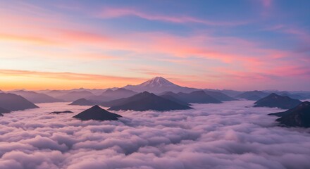 Naklejka premium Majestic Mountain Peaks Above Sea of Clouds at Sunrise
