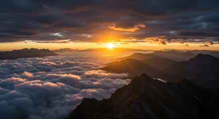 Majestic Mountain Peaks Above Sea of Clouds at Sunrise