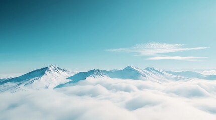 Snow Covered Mountains Rising Above Sea of Clouds with Blue Sky