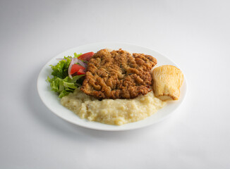 Close-up shot of a traditional breaded meat cutlet, known as 