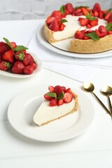 Delicious cheesecake with strawberries and mint on white wooden table, above view