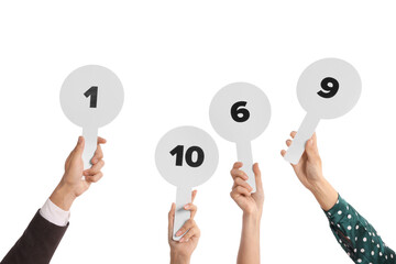 Panel of judges voting with score signs on white background, closeup