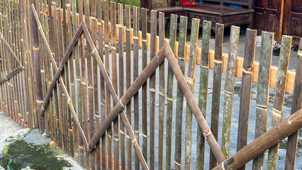 A bamboo fence to block the garden area is used to decorate the garden