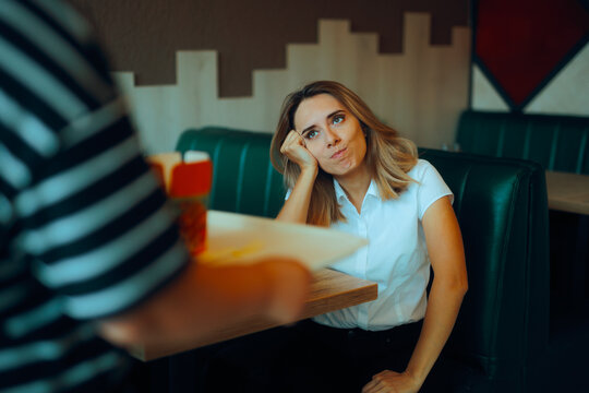 Customer Tired of Waiting for Her Food Order Feeling Angry. Irritated client complaining about the slow service in a restaurant