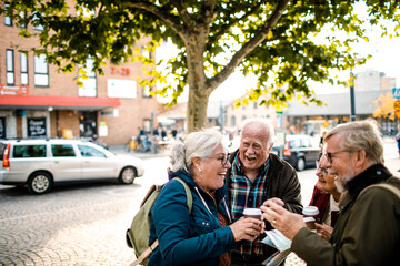 Senior friends exploring a town together on vacation