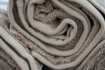 Fototapeta premium Rolled Brown Towels in a Spa Setting – Calm and Cozy Aesthetic