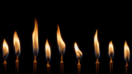 Row of flickering candle flames
