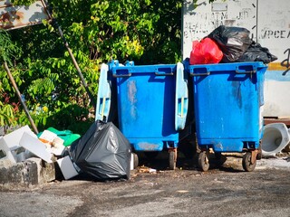Ensuring our environment stays clean, these blue trash cans are perfect for waste containment....
