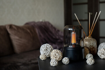Close up of home perfume scent air humidifier with light. Aromatherapy holistic health practices concept. Stress relief activities preparing for meditation. Simple pleasures healing habits
