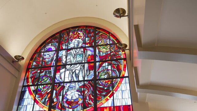 Panning out to stained glass windows at a church.