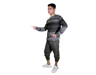 A confident young man in a grey patterned sweater and pants stands pointing to the side.
