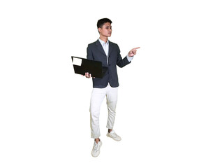 A young man in a suit is holding a laptop while pointing as if clicking, showcasing the concept of online business and modern digital technology.