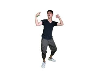 An energetic young Asian man in casual wear shouts and gestures triumphantly in celebration.