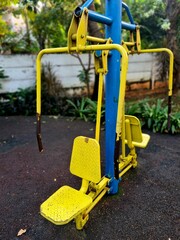 Yellow chest press machine for arm
