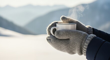 Warm winter drink in snowy mountains