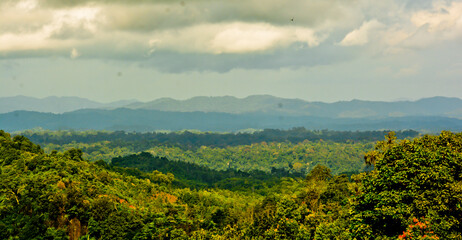 beautiful view of green mountain landscape with white clouds in the background