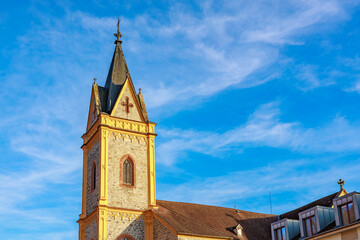 Fototapeta premium Historic european church tower against blue sky