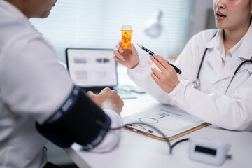 Fototapeta premium A doctor is talking to a patient about a prescription