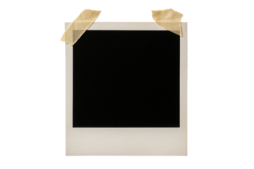 A black and white photo with tape on it