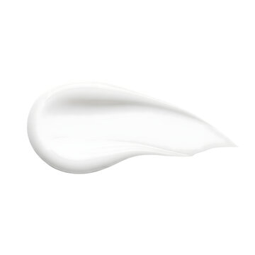 A smooth swirl of white cream is isolated against a transparent background in a studio shot